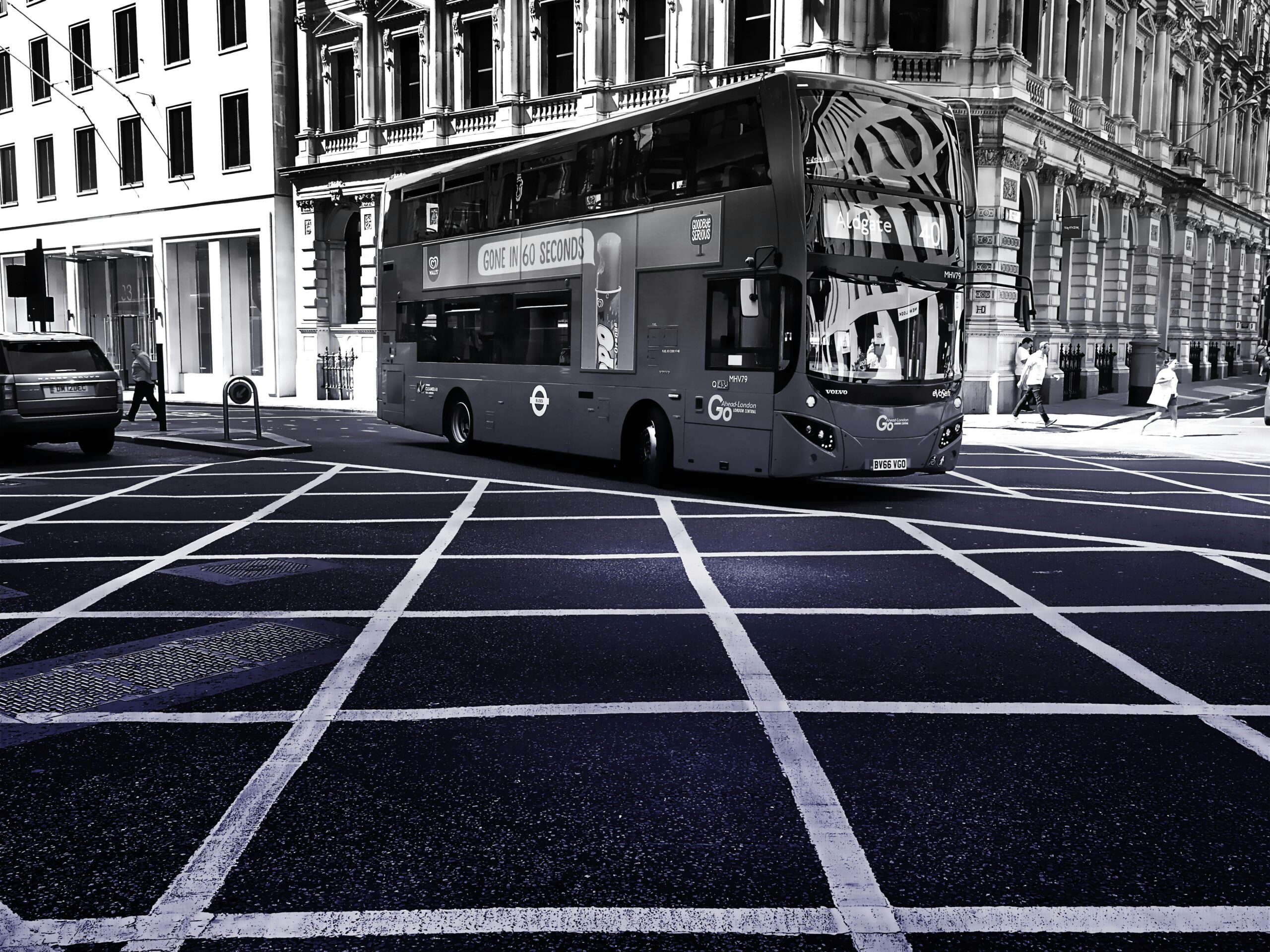 Day Trips from New York by Bus: Breaking Free from the Concrete Maze in 2025 2 Monochrome image of a double-decker bus on London's urban streets, showcasing transportation and city life.