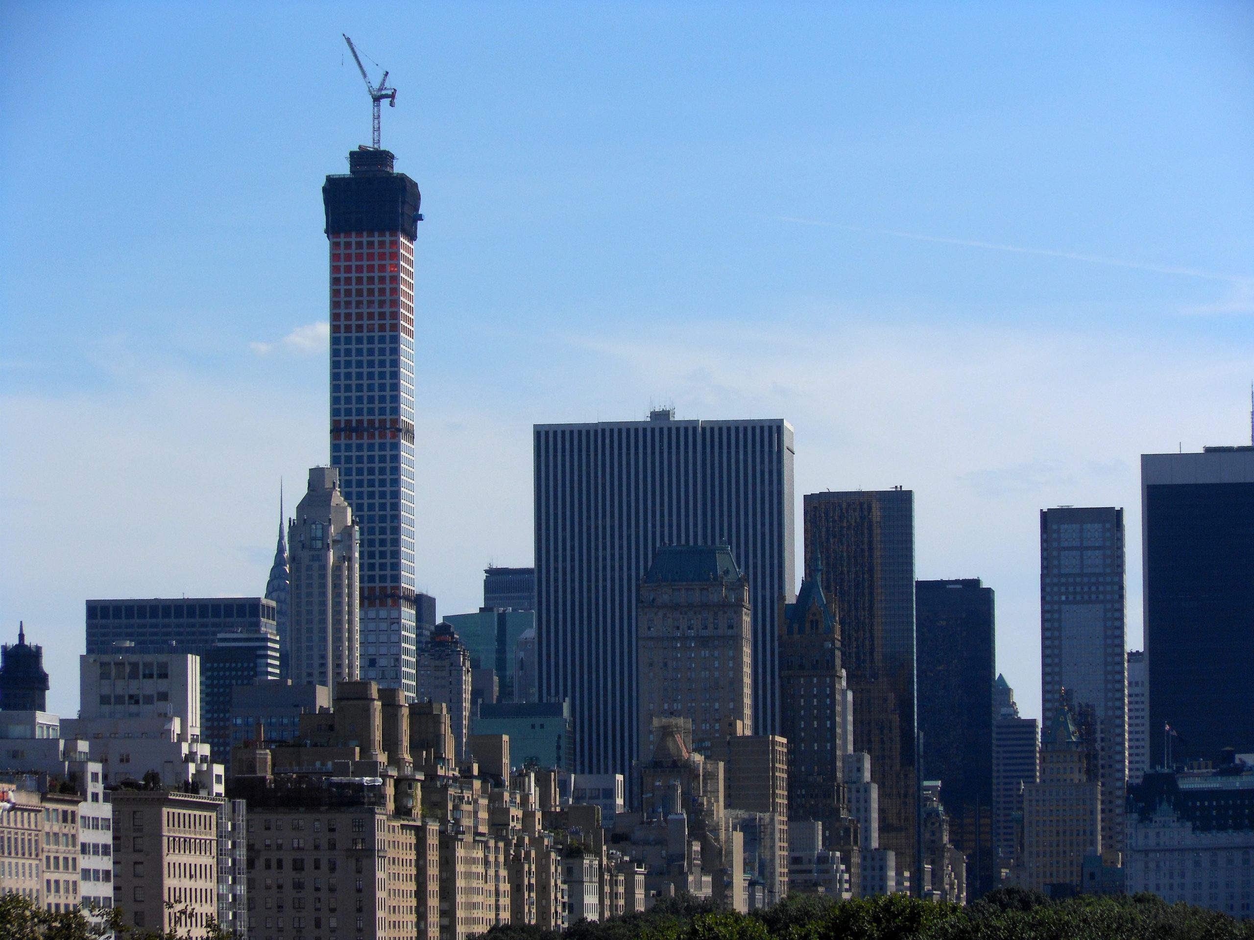 Stunning view of New York City skyline with a prominent skyscraper under construction.