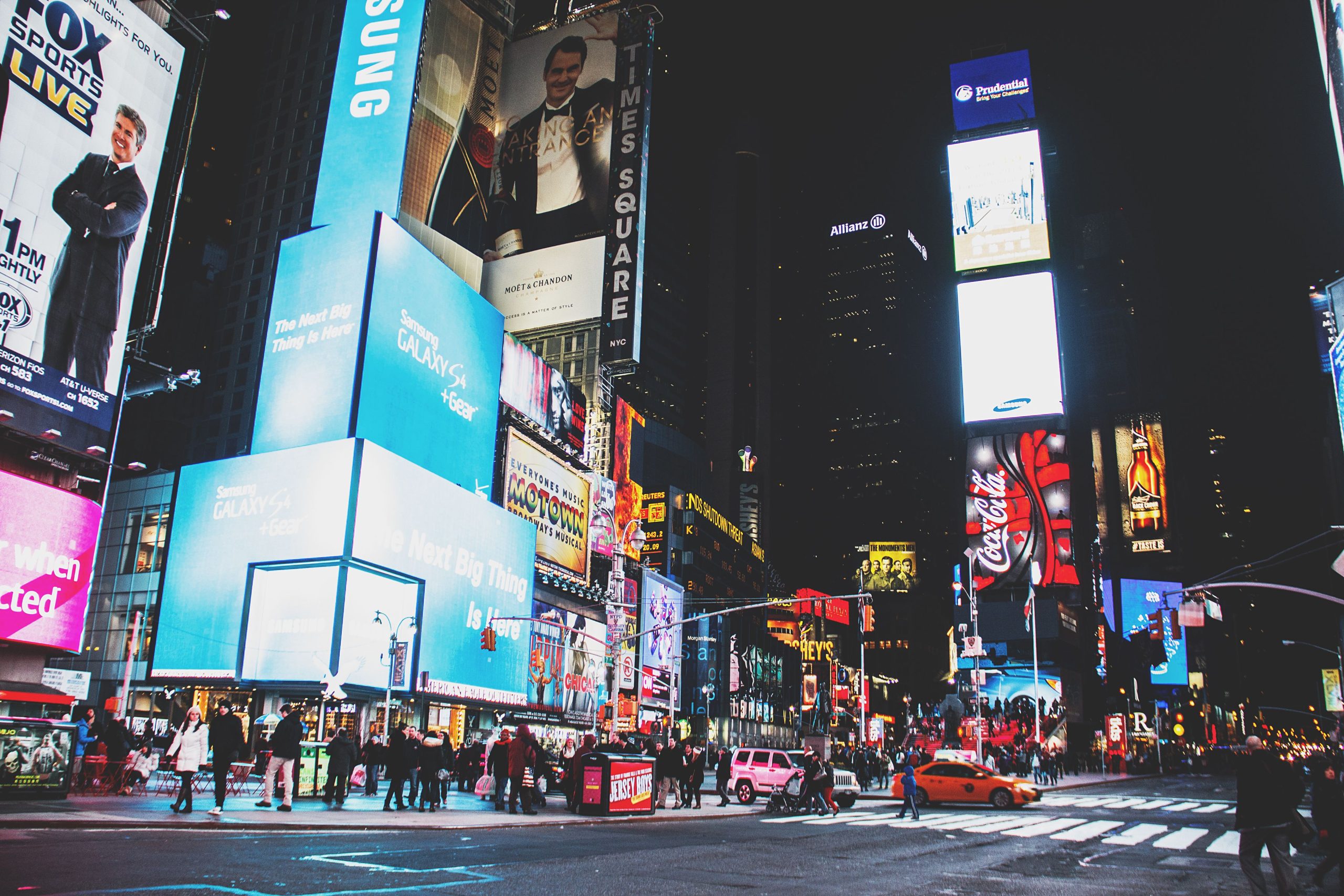 Event Transportation NYC in 2026: The Ultimate Smart Guide 7 Dynamic night scene with neon lights and bustling crowds in Times Square, New York City.
