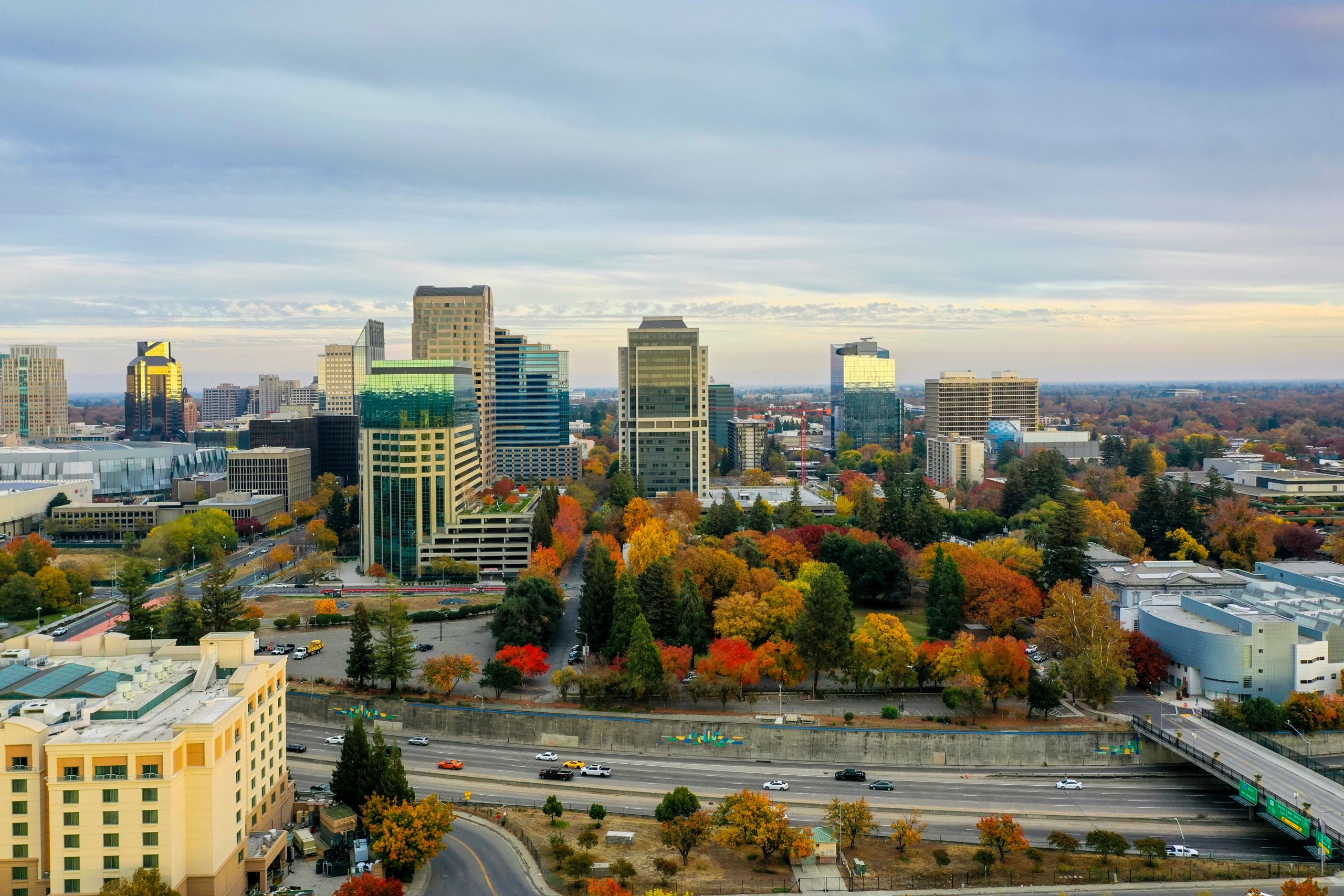 Group Transportation Tri-State Area in 2026: A Real-World Guide to Moving Your Crowd 7 A vibrant aerial view of Sacramento's skyline showcasing fall foliage and modern architecture.